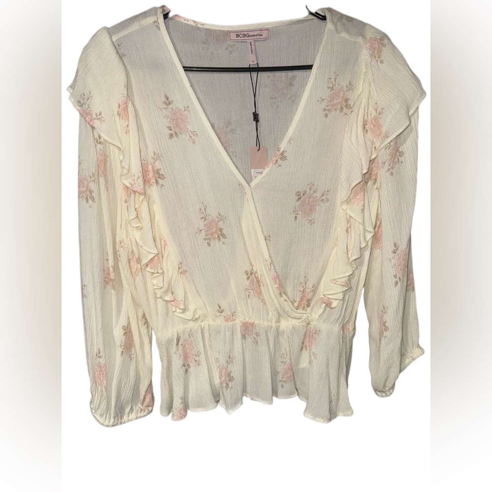 Beautiful peplum BCBGeneration blouse size medium brand new with tags!